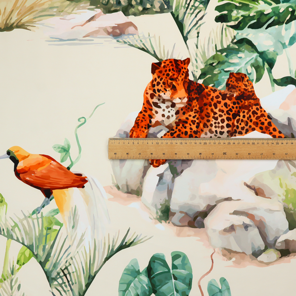 A tropical fabric pattern featuring leopards lounging on rocks amidst lush green foliage, palm fronds, and vibrant orange birds against a light background.