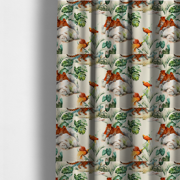 The fabric used to create these made-to-measure curtains s a tropical fabric pattern featuring leopards lounging on rocks amidst lush green foliage, palm fronds, and vibrant orange birds against a light background.