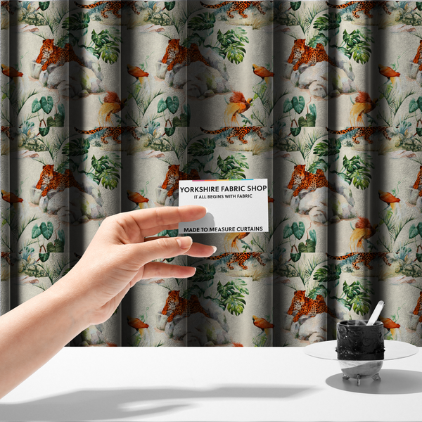 The fabric used to create these made-to-measure curtains s a tropical fabric pattern featuring leopards lounging on rocks amidst lush green foliage, palm fronds, and vibrant orange birds against a light background.