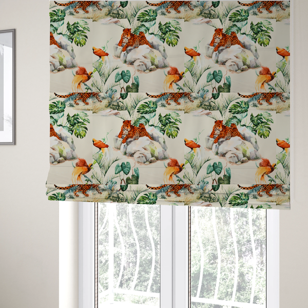 The fabric used to create these Roman blinds is a tropical fabric pattern featuring leopards lounging on rocks amidst lush green foliage, palm fronds, and vibrant orange birds against a light background.