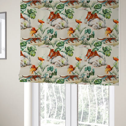 The fabric used to create these Roman blinds is a tropical fabric pattern featuring leopards lounging on rocks amidst lush green foliage, palm fronds, and vibrant orange birds against a light background.