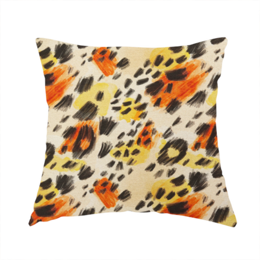The fabric used to create this handmade cushion is an abstract leopard print fabric featuring a light beige background with painterly, watercolour-style spots in shades of burnt orange, vibrant yellow, and charcoal black, accented with dashed, hand-drawn sketch lines.