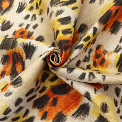 An abstract leopard print fabric featuring a light beige background with painterly, watercolour-style spots in shades of burnt orange, vibrant yellow, and charcoal black, accented with dashed, hand-drawn sketch lines.