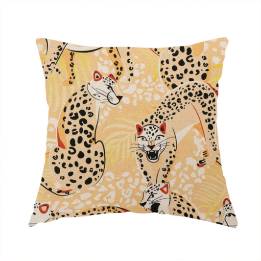 The fabric used to create this handmade cushion is a playful patterned fabric featuring illustrated leopards in various poses with black spots and red-tipped ears, set against a warm yellow and beige jungle foliage background.   