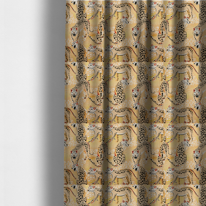 The fabric used to create these made-to-measure curtains is a playful patterned fabric featuring illustrated leopards in various poses with black spots and red-tipped ears, set against a warm yellow and beige jungle foliage background.   