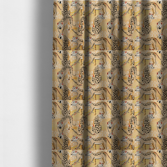 The fabric used to create these made-to-measure curtains is a playful patterned fabric featuring illustrated leopards in various poses with black spots and red-tipped ears, set against a warm yellow and beige jungle foliage background.   