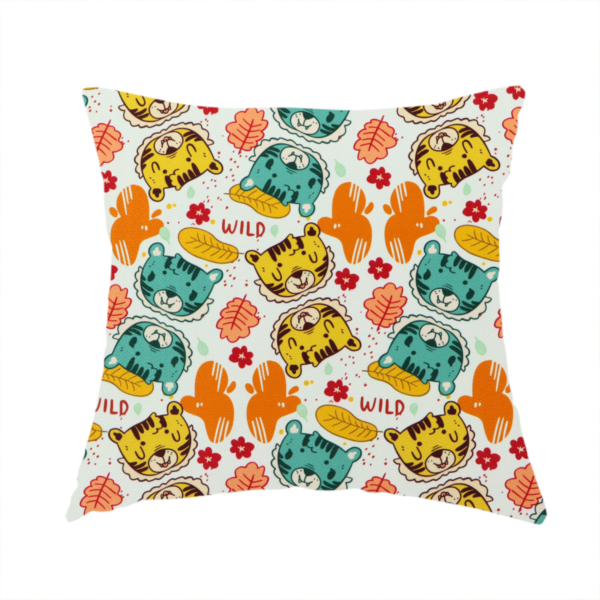 The fabric used to create this handmade cushion is a playful cartoon fabric print on a light background featuring alternating yellow and turquoise tiger cub faces, orange cactus silhouettes, yellow leaves, red flower blossoms, and the word "WILD" written in red text.   