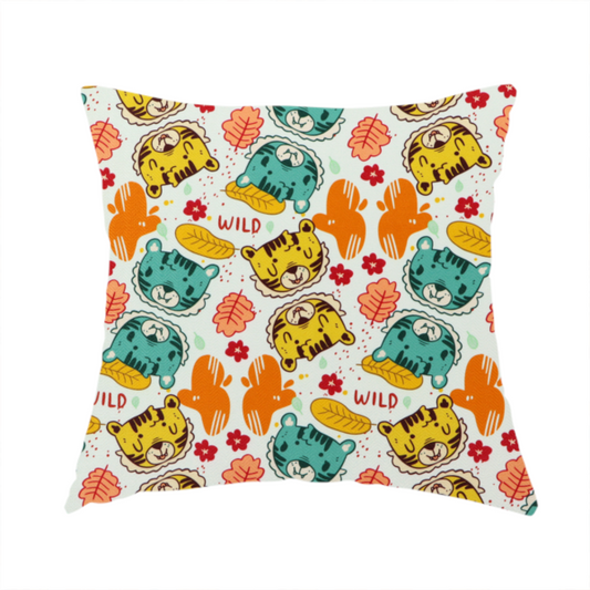 The fabric used to create this handmade cushion is a playful cartoon fabric print on a light background featuring alternating yellow and turquoise tiger cub faces, orange cactus silhouettes, yellow leaves, red flower blossoms, and the word "WILD" written in red text.   