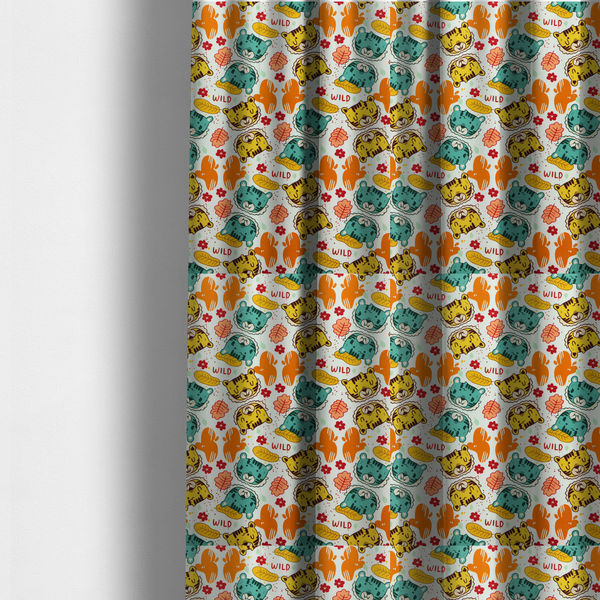 The fabric used to create these made-to-measure curtains is a playful cartoon fabric print on a light background featuring alternating yellow and turquoise tiger cub faces, orange cactus silhouettes, yellow leaves, red flower blossoms, and the word "WILD" written in red text.   