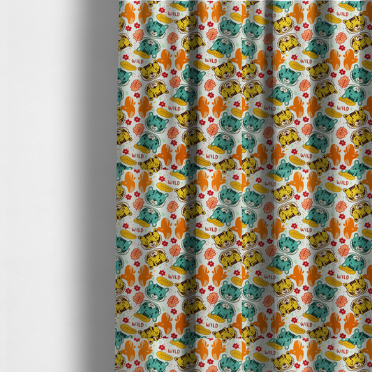 The fabric used to create these made-to-measure curtains is a playful cartoon fabric print on a light background featuring alternating yellow and turquoise tiger cub faces, orange cactus silhouettes, yellow leaves, red flower blossoms, and the word "WILD" written in red text.   