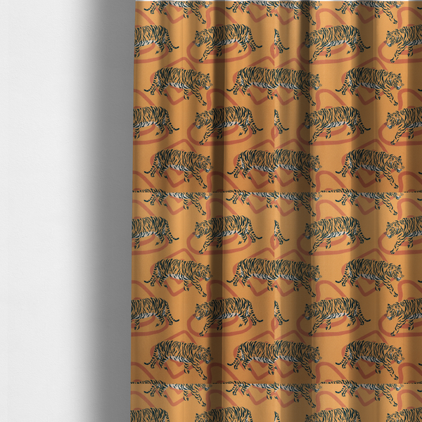 The fabric used to create these made-to-measure curtains is a  striking upholstery fabric on a warm mustard-yellow background featuring a repeating pattern of prowling tigers in black stripes over abstract terracotta-coloured organic shapes.   
