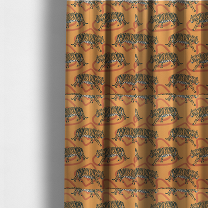 The fabric used to create these made-to-measure curtains is a  striking upholstery fabric on a warm mustard-yellow background featuring a repeating pattern of prowling tigers in black stripes over abstract terracotta-coloured organic shapes.   