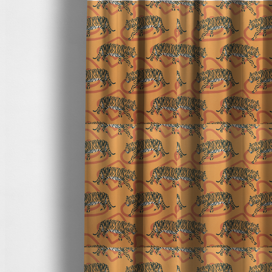 The fabric used to create these made-to-measure curtains is a  striking upholstery fabric on a warm mustard-yellow background featuring a repeating pattern of prowling tigers in black stripes over abstract terracotta-coloured organic shapes.   