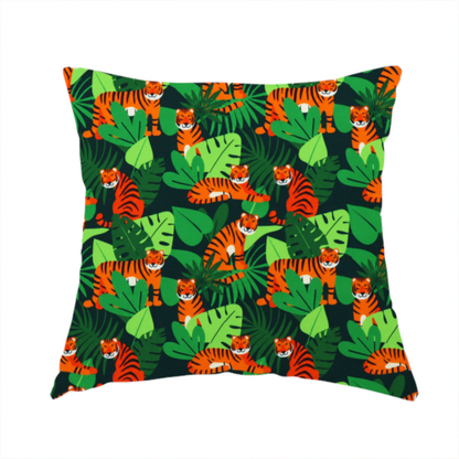 The fabric used to create this handmade cushion is a vibrant jungle pattern fabric featuring orange and black tigers nestled among lush green tropical leaves and foliage against a dark background.   