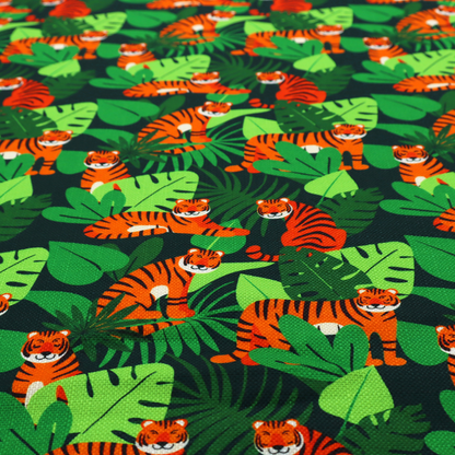 A vibrant jungle pattern fabric featuring orange and black tigers nestled among lush green tropical leaves and foliage against a dark background.   