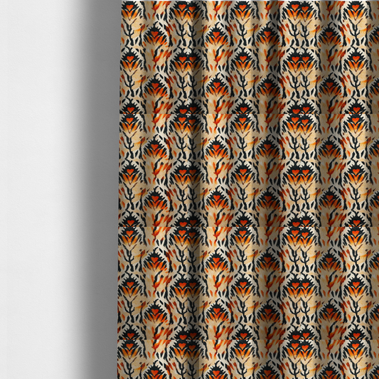 The fabric used to create these made-to-measure curtains is a abstract ikat fabric pattern featuring symmetrical, feather-like motifs in shades of burnt orange, cream, and dark charcoal black against a textured light background.   