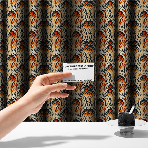 The fabric used to create these made-to-measure curtains is a abstract ikat fabric pattern featuring symmetrical, feather-like motifs in shades of burnt orange, cream, and dark charcoal black against a textured light background.   