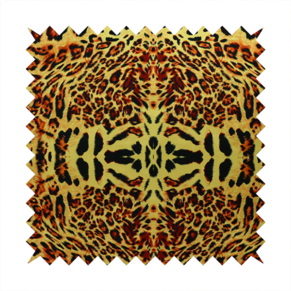 A bold, symmetrical leopard print fabric featuring a repeating kaleidoscope pattern of black and golden-brown rosettes on a warm yellow-gold background.