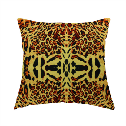 The fabric used to create this handmade cushion is a bold, symmetrical leopard print fabric featuring a repeating kaleidoscope pattern of black and golden-brown rosettes on a warm yellow-gold background.