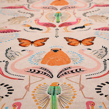 A whimsical tropical jungle patterned fabric featuring pink flamingos, orange orangutans, monarch butterflies, lemurs with striped tails, and vibrant birds on a light beige background.   
