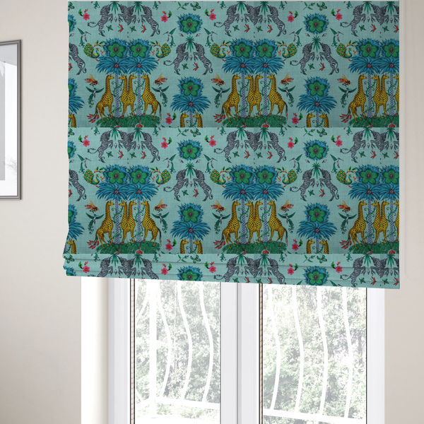 The fabric used to create these Roman blinds is an enchanting turquoise-toned fabric pattern featuring zebras, giraffes, hummingbirds, peacocks, bees, and mystical blue flowers with eye motifs on a light aqua background.