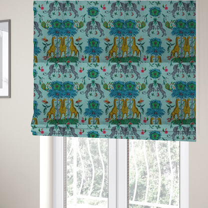 The fabric used to create these Roman blinds is an enchanting turquoise-toned fabric pattern featuring zebras, giraffes, hummingbirds, peacocks, bees, and mystical blue flowers with eye motifs on a light aqua background.