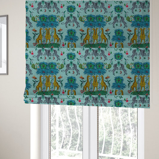 The fabric used to create these Roman blinds is an enchanting turquoise-toned fabric pattern featuring zebras, giraffes, hummingbirds, peacocks, bees, and mystical blue flowers with eye motifs on a light aqua background.