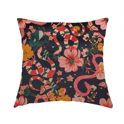 The fabric used to create this handmade cushion is a rich, dark botanical fabric pattern featuring intertwined pink and red snakes, large pink and yellow flowers, and delicate butterflies against a dark navy background.