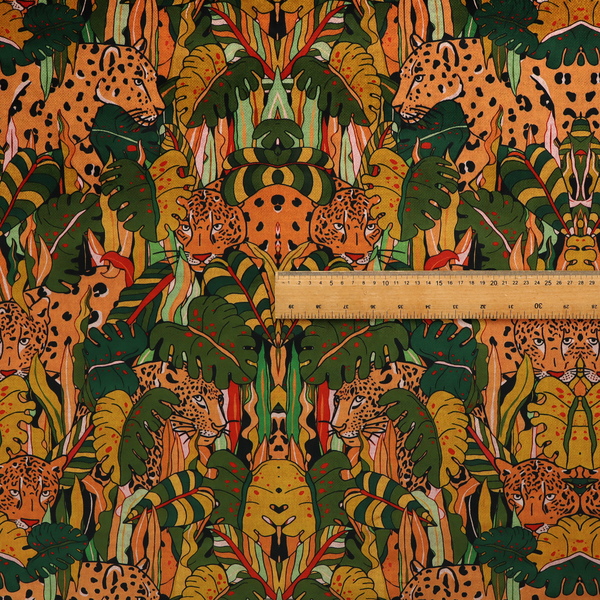 An intricate, symmetrical jungle pattern fabric featuring spotted leopards and lush green tropical foliage in warm autumn tones of orange, gold, and deep green.