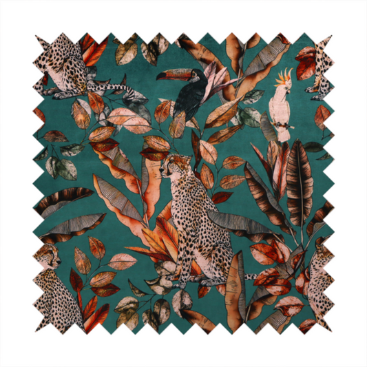 A moody teal fabric pattern featuring seated leopards, a toucan, and a white cockatoo amidst autumn-toned tropical leaves and foliage.