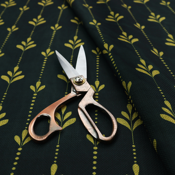 Dark green fabric featuring a repeating vertical pattern of chartreuse botanical motifs and dotted lines.   