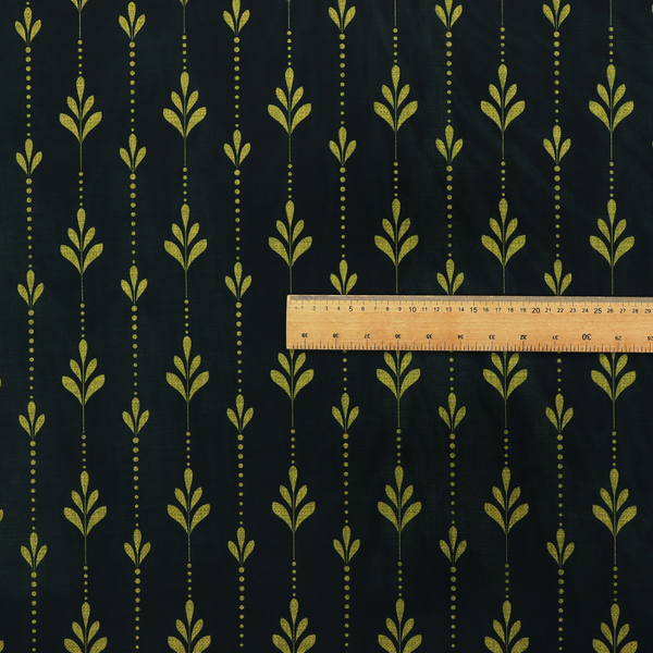 Dark green fabric featuring a repeating vertical pattern of chartreuse botanical motifs and dotted lines.   