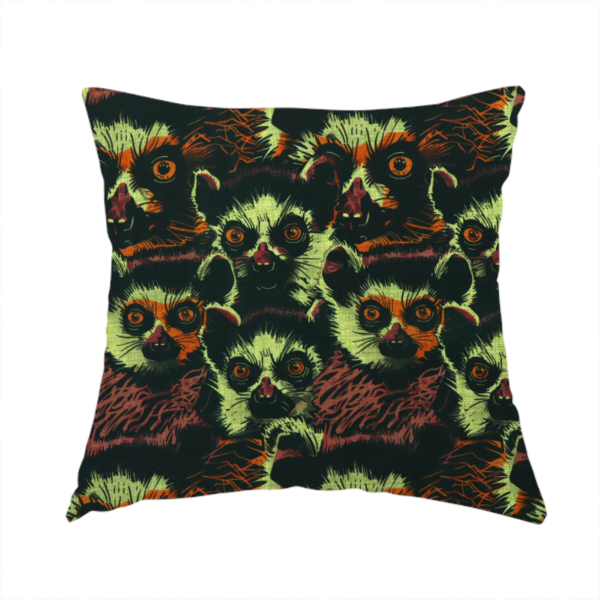The fabric used to create this handmade cushion is a fabric pattern featuring a repeating, illustrated design of lemur faces in lime green, orange, and dark brown.   