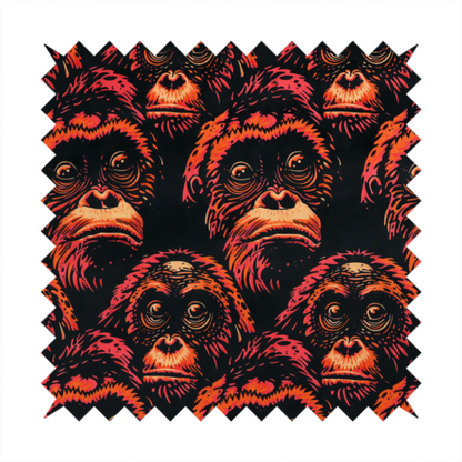 Fabric pattern featuring a repeating graphic illustration of orangutan faces in orange, peach, and reddish-pink tones against a dark black background.   