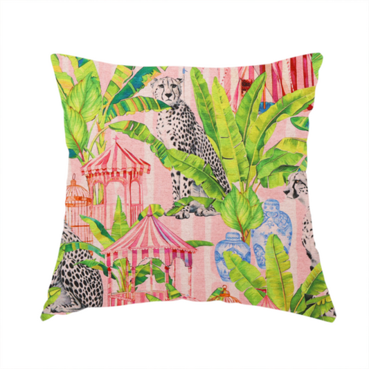 The fabric used to create this handmade cushion is a pink striped fabric with a repeating pattern of seated cheetahs, tropical banana palm leaves, pink striped pavilions, birdcages, and blue porcelain ginger jars.   