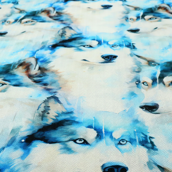 Light fabric featuring a repeating watercolour pattern of husky or wolf portraits in shades of ice blue, teal, navy, and white.   