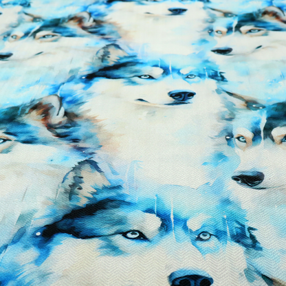 Light fabric featuring a repeating watercolour pattern of husky or wolf portraits in shades of ice blue, teal, navy, and white.   