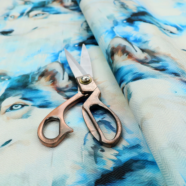 Light fabric featuring a repeating watercolour pattern of husky or wolf portraits in shades of ice blue, teal, navy, and white.   