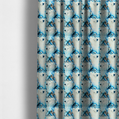 The fabric used to create these made-to-measure curtains is a light fabric featuring a repeating watercolour pattern of husky or wolf portraits in shades of ice blue, teal, navy, and white.   
