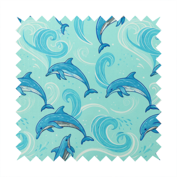Aqua blue fabric with a repeating pattern of playful blue dolphins leaping through swirling white ocean waves and water splashes.   