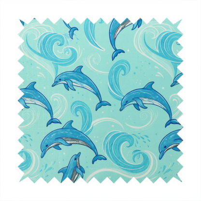 Aqua blue fabric with a repeating pattern of playful blue dolphins leaping through swirling white ocean waves and water splashes.   