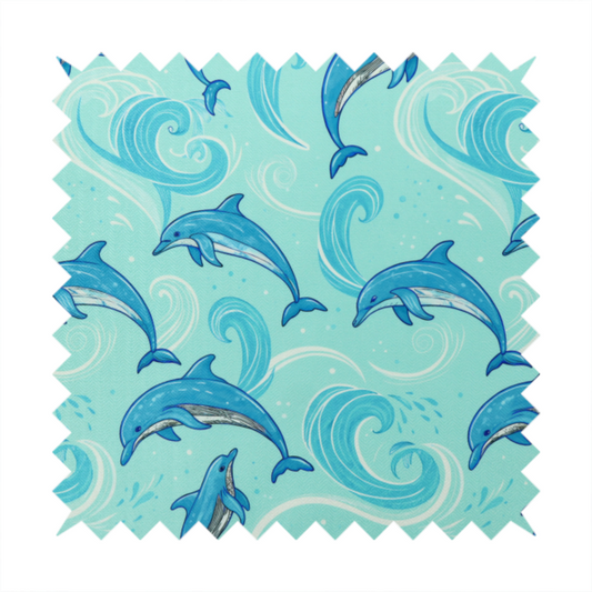 Aqua blue fabric with a repeating pattern of playful blue dolphins leaping through swirling white ocean waves and water splashes.   
