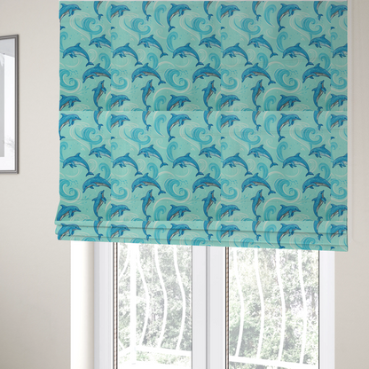 The fabric used to create these Roman blinds is an aqua blue fabric with a repeating pattern of playful blue dolphins leaping through swirling white ocean waves and water splashes.   