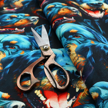 Fabric pattern featuring a repeating, artistic illustration of smiling Rottweiler dog portraits with vibrant blue fur, tan markings, and open mouths with tongues out.   