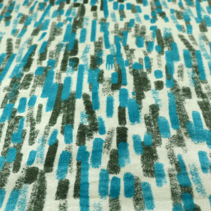 A textured abstract pattern featuring vertical brushstrokes or chalk-like marks in shades of vibrant turquoise blue and deep forest green against a light off-white or cream background.