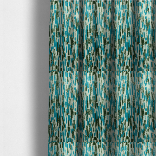 The fabric used to create these made-to-measure curtains is a textured abstract pattern featuring vertical brushstrokes or chalk-like marks in shades of vibrant turquoise blue and deep forest green against a light off-white or cream background.