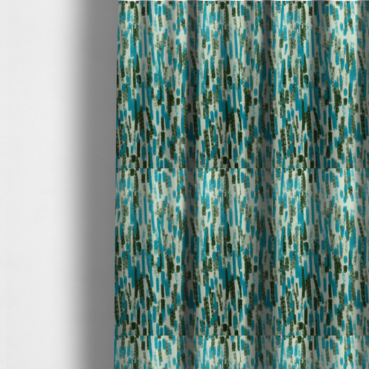 The fabric used to create these made-to-measure curtains is a textured abstract pattern featuring vertical brushstrokes or chalk-like marks in shades of vibrant turquoise blue and deep forest green against a light off-white or cream background.