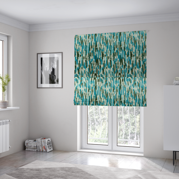 The fabric used to create these Roman blinds is a textured abstract pattern featuring vertical brushstrokes or chalk-like marks in shades of vibrant turquoise blue and deep forest green against a light off-white or cream background.