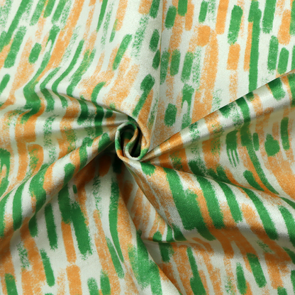 A textured abstract pattern featuring vertical brushstrokes or chalk-like marks in shades of vibrant orange and green against a light off-white or cream background.   