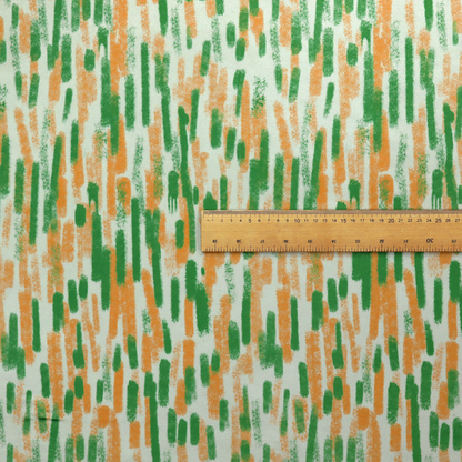 A textured abstract pattern featuring vertical brushstrokes or chalk-like marks in shades of vibrant orange and green against a light off-white or cream background.   